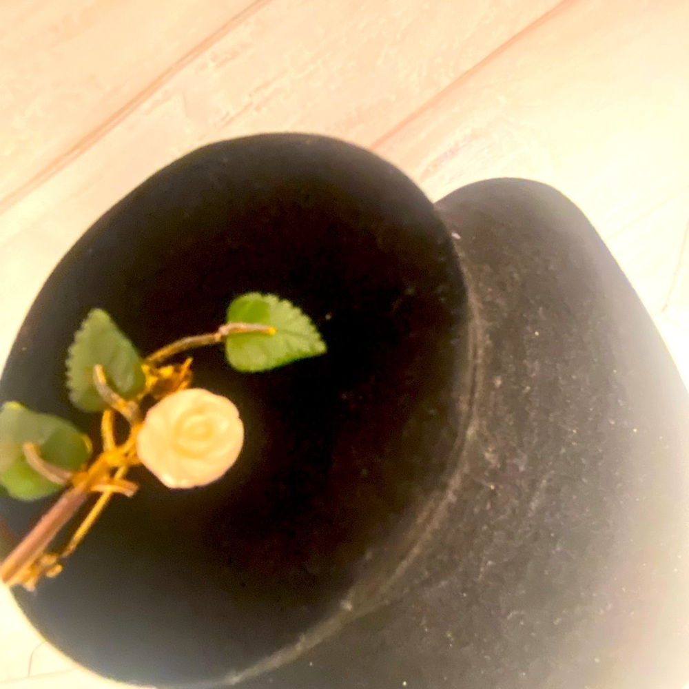 Women’s fancy gold tone brooch with white resin rose and green.